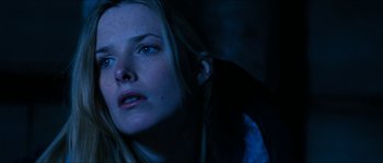 Movie still from “The Descent” (2005), directed by Neil Marshall – A person with blue eyes; Close Up shot, Low angle