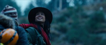 Movie still from “The Descent” (2005), directed by Neil Marshall – A woman wearing a hat and a backpack; Close Up shot, Low angle