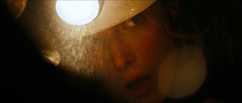 Movie still from “The Descent” (2005), directed by Neil Marshall – A person wearing a hat; Extreme Close Up shot, Overhead angle