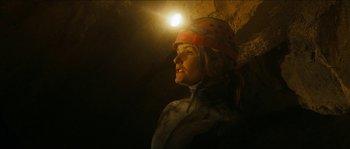 Movie still from “The Descent” (2005), directed by Neil Marshall – A woman wearing a helmet is standing in a cave; Close Up shot, Low angle