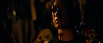 Movie still from “The Descent” (2005), directed by Neil Marshall – A person wearing a black shirt; Close Up shot, Low angle