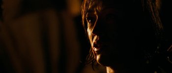 Movie still from “The Descent” (2005), directed by Neil Marshall – A person with wet hair; Close Up shot, Over the shoulder angle