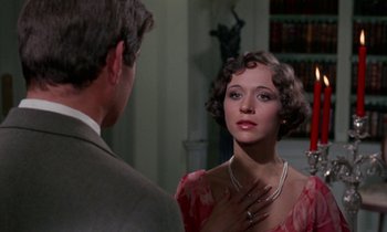 Movie still from “The Devil Rides Out” (1968), directed by Terence Fisher – A man and a woman are looking at each other; Close Up shot, Over the shoulder angle