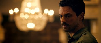 Movie still from “The Devil's Double” (2011), directed by Lee Tamahori – A person wearing a black shirt; Close Up shot, Over the shoulder angle