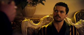 Movie still from “The Devil's Double” (2011), directed by Lee Tamahori – A person sitting in a chair; Close Up shot, Over the shoulder angle