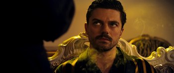 Movie still from “The Devil's Double” (2011), directed by Lee Tamahori – A person wearing a shirt; Close Up shot, Over the shoulder angle