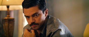 Movie still from “The Devil's Double” (2011), directed by Lee Tamahori – A person wearing a shirt; Close Up shot, Over the shoulder angle