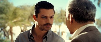 Movie still from “The Devil's Double” (2011), directed by Lee Tamahori – A person talking to another person; Close Up shot, Over the shoulder angle