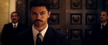 Movie still from “The Devil's Double” (2011), directed by Lee Tamahori – A person wearing a suit and tie; Close Up shot, Overhead angle