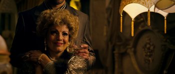 Movie still from “The Devil's Double” (2011), directed by Lee Tamahori – A man and a woman posing for a picture; Close Up shot, Over the shoulder angle