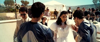 Movie still from “The Devil's Double” (2011), directed by Lee Tamahori – A man and a woman dressed in wedding attire; Medium shot, Over the shoulder angle