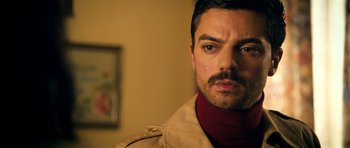 Movie still from “The Devil's Double” (2011), directed by Lee Tamahori – A person wearing a jacket; Close Up shot, Over the shoulder angle