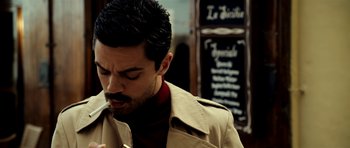 Movie still from “The Devil's Double” (2011), directed by Lee Tamahori – A person smoking a cigarette; Close Up shot, Low angle