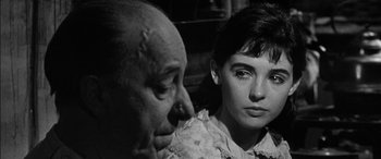 Movie still from “The Diary of Anne Frank” (1959), directed by George Stevens – An older man and a young woman looking at each other; Close Up shot, Over the shoulder angle