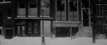 Movie still from “The Diary of Anne Frank” (1959), directed by George Stevens – A street light in the middle of a snowy street; Extreme Wide shot, Low angle