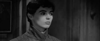 Movie still from “The Diary of Anne Frank” (1959), directed by George Stevens – Black and white photograph of a woman in a jacket; Close Up shot, Low angle