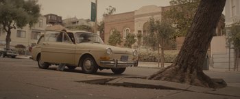 Movie still from “The Diary of a Teenage Girl” (2015), directed by Marielle Heller – An old car parked on the side of the street; Extreme Wide shot, Low angle