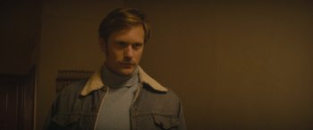 Movie still from “The Diary of a Teenage Girl” (2015), directed by Marielle Heller – A man with a beard wearing a jean jacket; Close Up shot, Over the shoulder angle