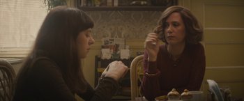 Movie still from “The Diary of a Teenage Girl” (2015), directed by Marielle Heller – Two women sitting at a table in front of each other; Medium shot, Over the shoulder angle