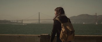 Movie still from “The Diary of a Teenage Girl” (2015), directed by Marielle Heller – A woman standing on a pier looking out at the ocean; Medium shot, Low angle