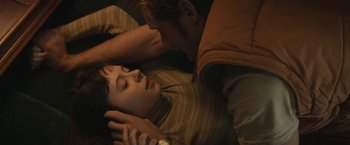 Movie still from “The Diary of a Teenage Girl” (2015), directed by Marielle Heller – A man and a woman laying on the ground; Close Up shot, Overhead angle