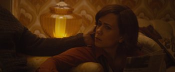 Movie still from “The Diary of a Teenage Girl” (2015), directed by Marielle Heller – A woman sitting on a couch with her head on a pillow; Close Up shot, Over the shoulder angle