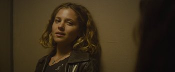 Movie still from “The Diary of a Teenage Girl” (2015), directed by Marielle Heller – A woman with long curly hair wearing a leather jacket; Close Up shot, Low angle