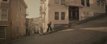 Movie still from “The Diary of a Teenage Girl” (2015), directed by Marielle Heller – A man riding a skateboard up a steep flight of stairs; Extreme Wide shot, Low angle