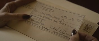 Movie still from “The Diary of a Teenage Girl” (2015), directed by Marielle Heller – A check with a pencil in it; Extreme Close Up shot, Overhead angle