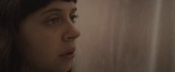 Movie still from “The Diary of a Teenage Girl” (2015), directed by Marielle Heller – A woman's face in a room; Close Up shot, High angle