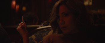 Movie still from “The Diary of a Teenage Girl” (2015), directed by Marielle Heller – A person sitting on a couch; Close Up shot, Over the shoulder angle