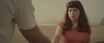 Movie still from “The Diary of a Teenage Girl” (2015), directed by Marielle Heller – A woman in a red striped shirt holding a man's hand; Close Up shot, Low angle