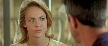 Movie still from “Le Dîner de Cons” (1998), directed by Francis Veber – A person looking at another person; Close Up shot, Over the shoulder angle