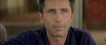 Movie still from “Le Dîner de Cons” (1998), directed by Francis Veber – A person with blue eyes; Close Up shot, Over the shoulder angle