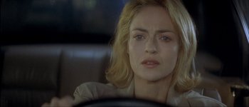 Movie still from “Le Dîner de Cons” (1998), directed by Francis Veber – A person sitting in a car; Close Up shot, Over the shoulder angle