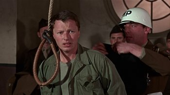 Movie still from “The Dirty Dozen” (1967), directed by Robert Aldrich – A man with a rope hanging from his neck; Close Up shot, Low angle