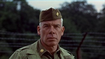 Movie still from “The Dirty Dozen” (1967), directed by Robert Aldrich – An older man in a military uniform; Close Up shot, Low angle
