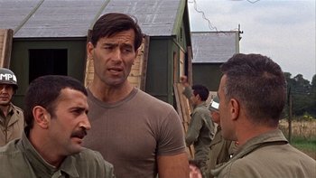 Movie still from “The Dirty Dozen” (1967), directed by Robert Aldrich – A group of men standing next to each other; Medium shot, Low angle