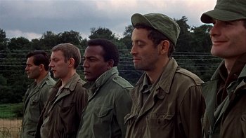 Movie still from “The Dirty Dozen” (1967), directed by Robert Aldrich – A group of men standing next to each other; Medium shot, Low angle