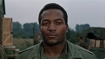 Movie still from “The Dirty Dozen” (1967), directed by Robert Aldrich – A person wearing a green shirt; Close Up shot, Low angle