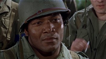 Movie still from “The Dirty Dozen” (1967), directed by Robert Aldrich – An african - american man in a military uniform; Close Up shot, Over the shoulder angle