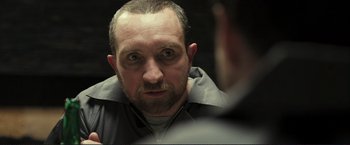 Movie still from “The Disappearance of Alice Creed” (2009), directed by J Blakeson – A person looking at a mirror; Close Up shot, Over the shoulder angle