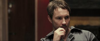 Movie still from “The Disappearance of Alice Creed” (2009), directed by J Blakeson – A person with a hand to his face; Close Up shot, Over the shoulder angle