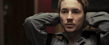 Movie still from “The Disappearance of Alice Creed” (2009), directed by J Blakeson – A person with a hand on his head; Close Up shot, Over the shoulder angle