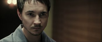 Movie still from “The Disappearance of Alice Creed” (2009), directed by J Blakeson – A person wearing a shirt; Close Up shot, Over the shoulder angle