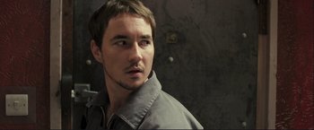 Movie still from “The Disappearance of Alice Creed” (2009), directed by J Blakeson – A person wearing a jacket; Close Up shot, Over the shoulder angle