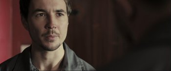 Movie still from “The Disappearance of Alice Creed” (2009), directed by J Blakeson – A person wearing a shirt; Close Up shot, Over the shoulder angle