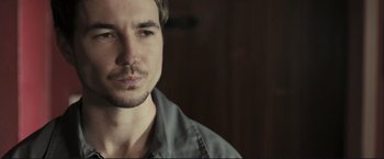 Movie still from “The Disappearance of Alice Creed” (2009), directed by J Blakeson – A person with a beard; Close Up shot, Over the shoulder angle