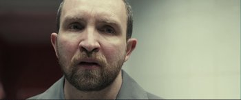 Movie still from “The Disappearance of Alice Creed” (2009), directed by J Blakeson – A person with a beard; Close Up shot, Over the shoulder angle
