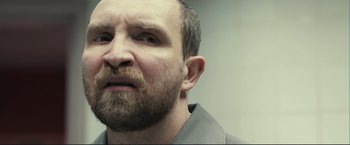 Movie still from “The Disappearance of Alice Creed” (2009), directed by J Blakeson – A person with a beard; Close Up shot, Over the shoulder angle